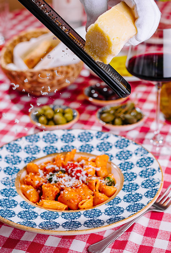 hef-grates-cheese-plate-with-fresh-penne-pasta.jpg