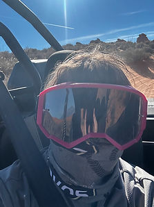 Author wearing Goggles riding in a ATV