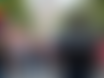 Police officer near rainbow flag at community event