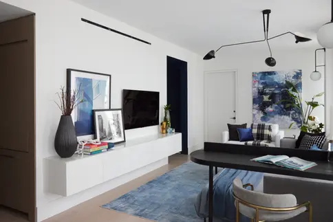 Downtown manhattan apartment living room with blue features