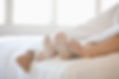 Couple's Feet in Bed