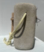 Thumbnail: Small hand carved limestone sculpture with yellow strap