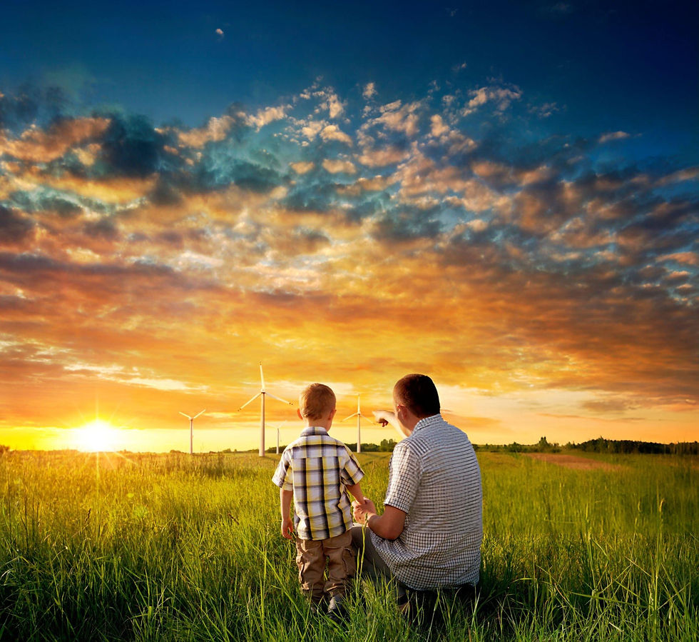 a father showing his kid wind turbines in a field