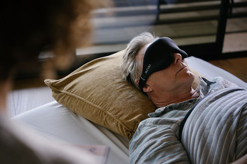 Person resting with eye mask during ketamine-assisted psychotherapy preparation session at Guided Journey Counseling