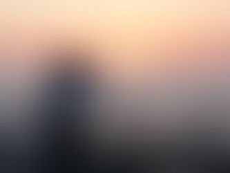 A couple watches the vibrant sunset over the Mediterranean Sea from Beirut Corniche