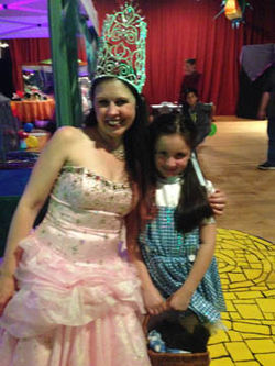 Shoshanna as Glinda the Good Witch and a young girl as Dorothy at a Wizard of Oz birthday party