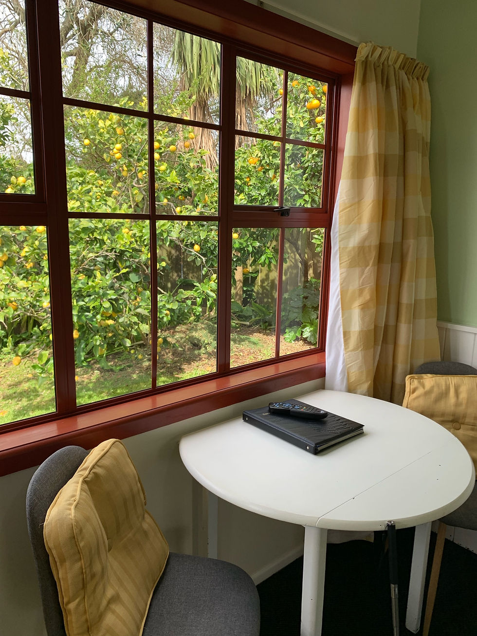 table and two chairs under window