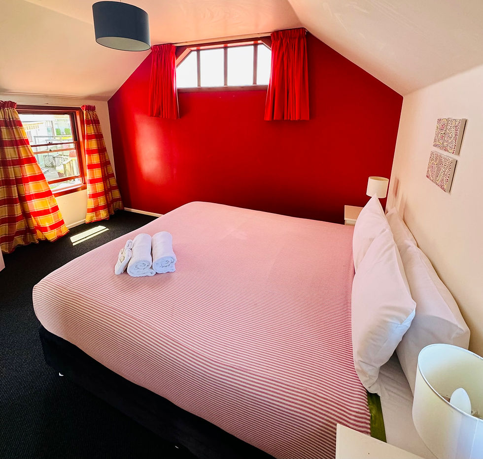 double bed in red bedroom