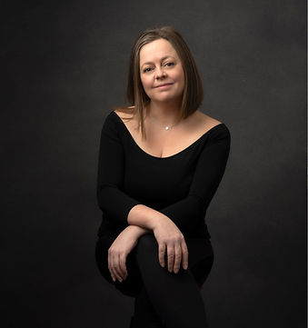 My headshot taken by me on a grey background. Professional headshot