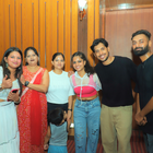 Emcee Agranshu at TDS Event with group of people smiling DHE Studio.