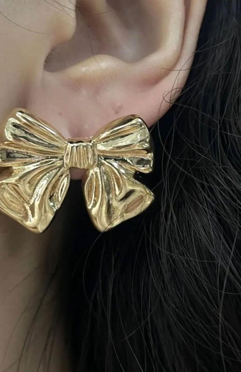 Thumbnail: Close-up of golden bow-shaped earring on ear, Silver and Golden Drop Korean Earrings.