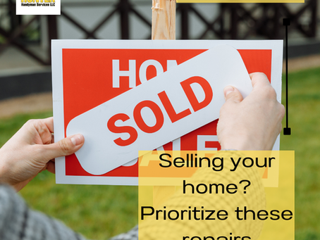 Someone putting a SOLD sticker on a for sale sign