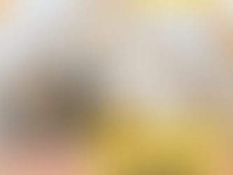 An attic with a mirror, chair and small desk