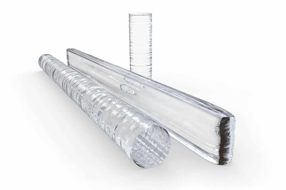 Three clear glass rods with textured surfaces are arranged on a white background, creating a minimalist and modern aesthetic.