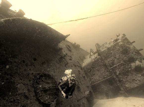 black and white picture of the c-58 shipwreck in cancun ,mexico