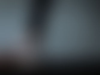 Image of a person's leg and foot in motion, running on a treadmill.