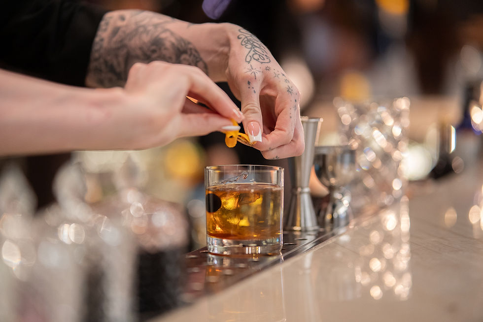 Bartender preparing Liam_s House Old Fashioned.