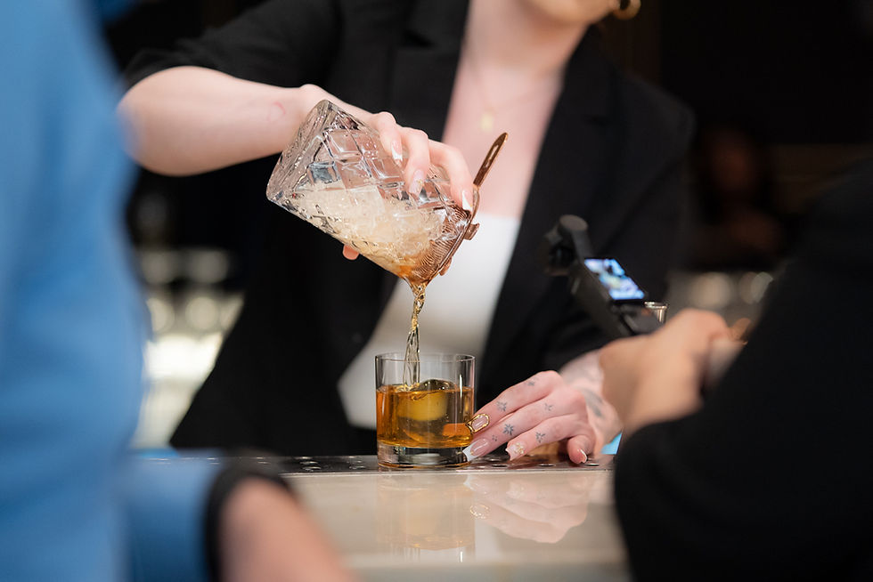 Bartender pouring Liam_s House Old Fashioned cocktail_s