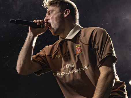 Silly Goose lead singer Jackson Foster singing into a microphone