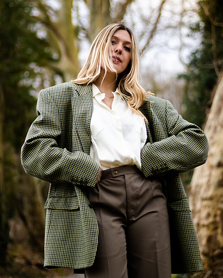 woman in oversized man's tweed jacket