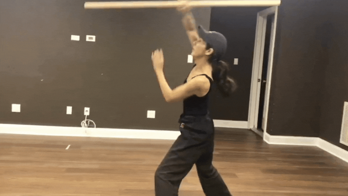 Kyo Kasumi demonstrating action with bo staff.