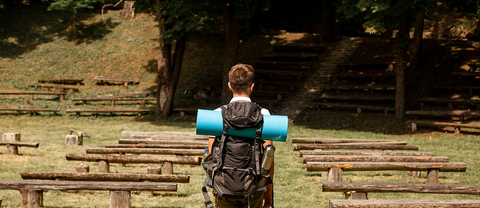 portrait-man-exploring-park-with-benches.jpg