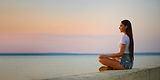calm-young-woman-tank-top-denim-shorts-sits-pier-sunset_edited.jpg