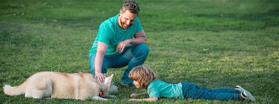 father-son-playing-with-dog-park-childhood-parenthood-kids-concept-happy-father-son-playin