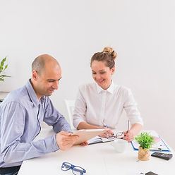 businessman-showing-digital-tablet-businesswoman-office.jpg