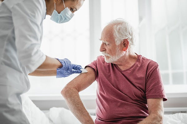 senior man receiving a shot