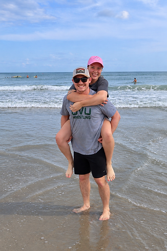 Colton and his wife together at the beach