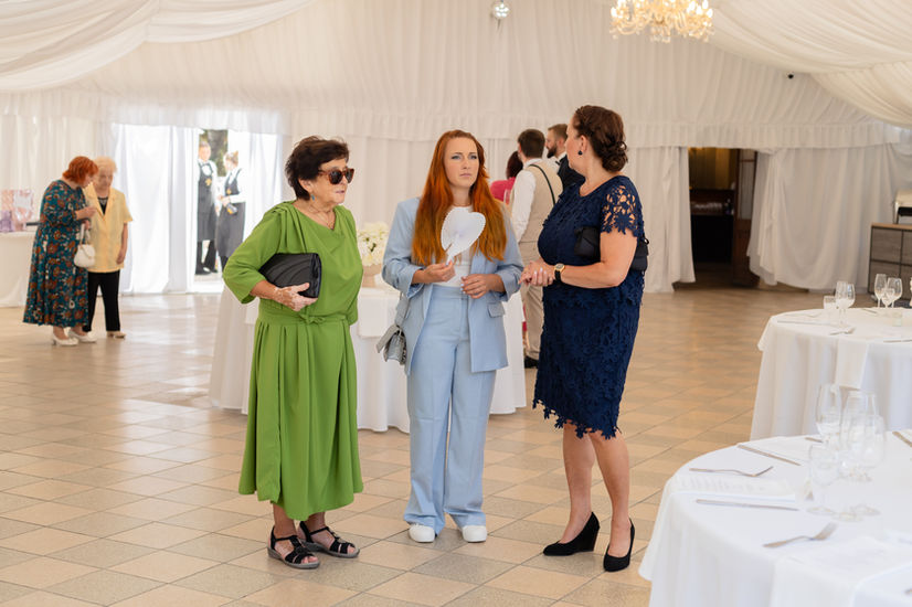 Candid wedding photography in Manchester of guests celebrating.