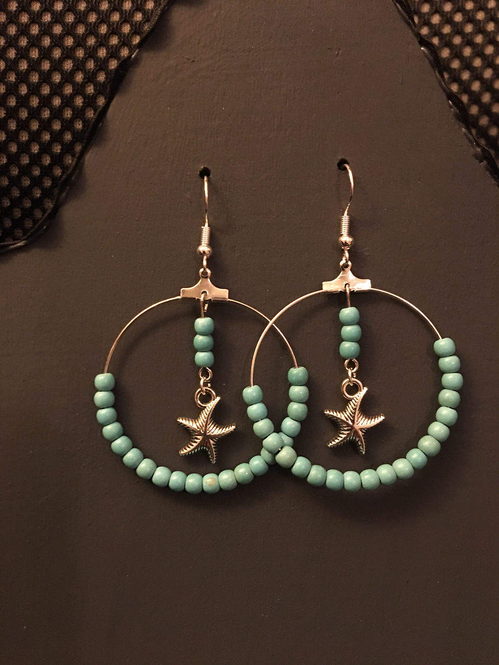 Thumbnail: Turquoise Beaded Circle Earrings With Starfish Pendants