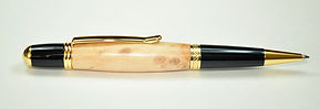 Hand-turned twist action ballpoint pen made from apple wood. .jpg