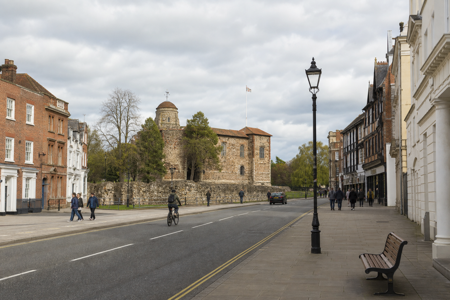 Street view with historical castle, cyclists, pedestrians, and cloudy sky.