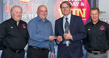 owner of Hitgas Ltd Chirs accepting an award