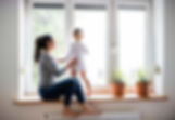 woman with child looking out of window.jpg