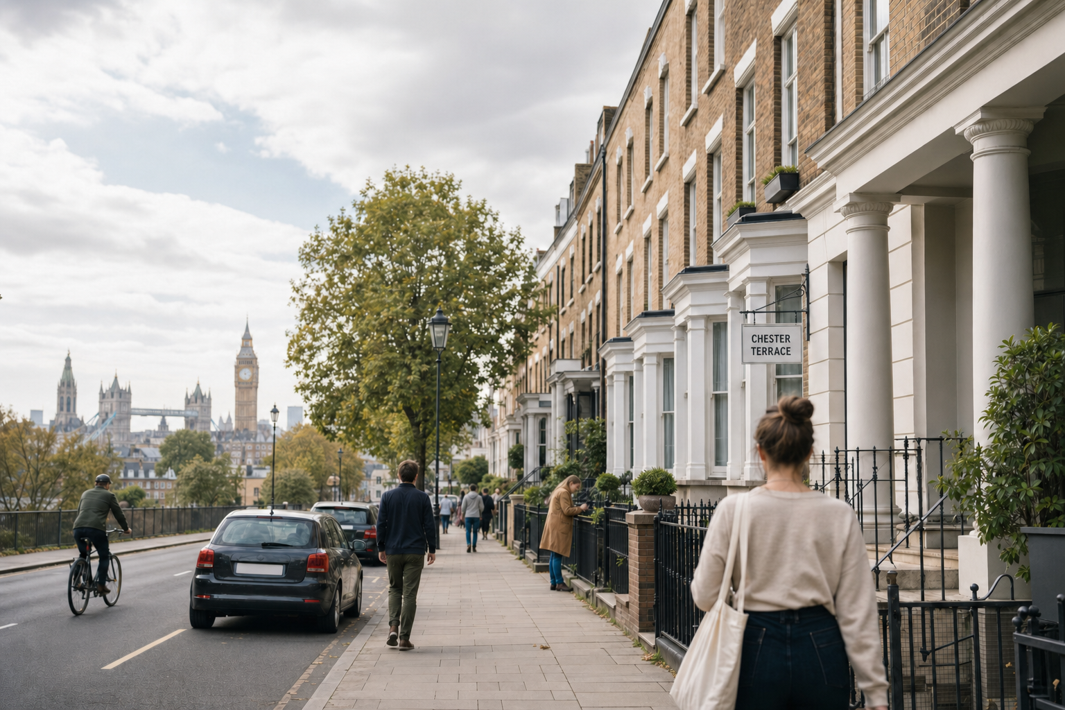 People walking and cycling along a residential street in London, with the Houses of Parliament visible in the background.