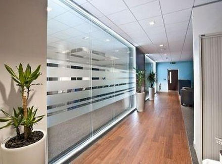 Glass partition system in modern workplace