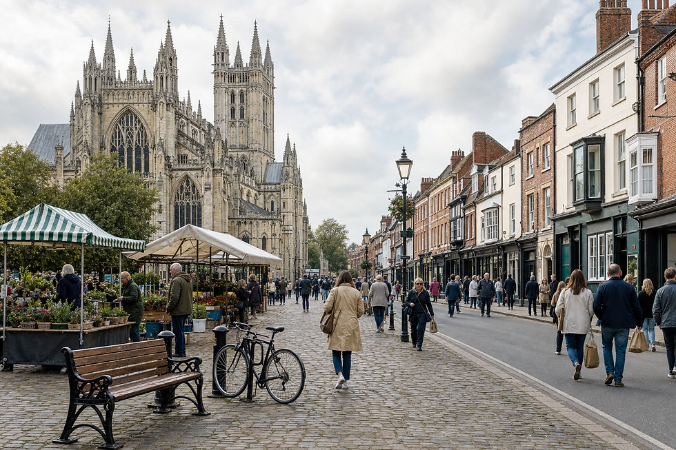 People walking near a large Gothic cathedral and market stalls on a cobbled street.