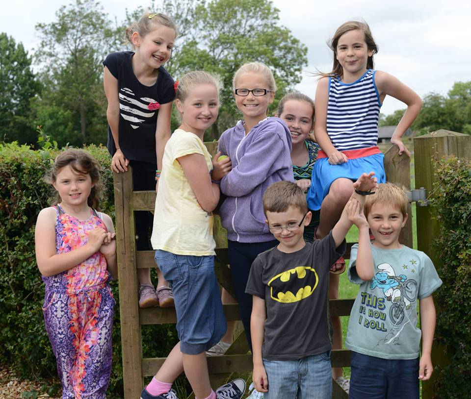Children on paddock gate at The Little Owl Art Stu