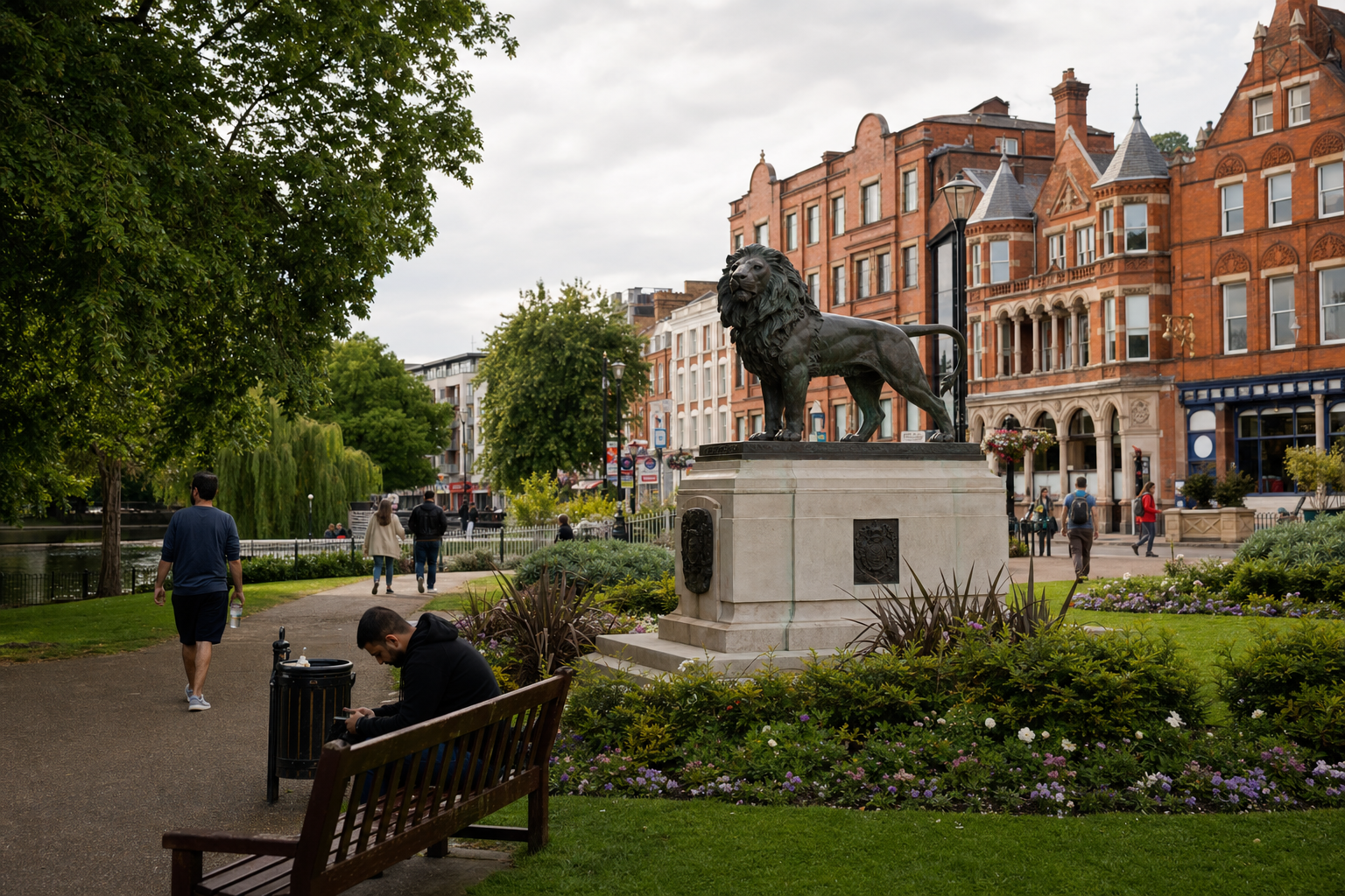 A lion statue stands on a plinth in a park surrounded by vibrant greenery and Victorian-style buildings.