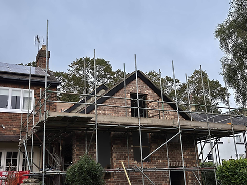 Home during roofing with scaffolding up