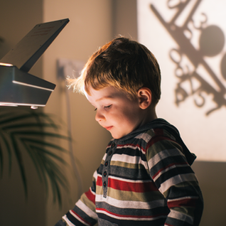 Little boy playing with shadows