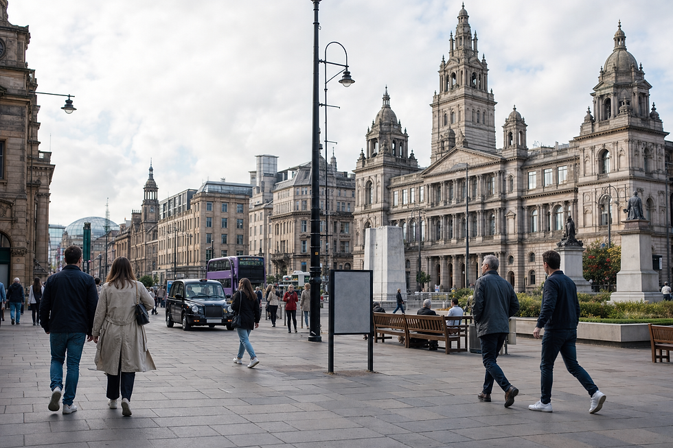 People walking through George Square in Glasgow, with historic buildings and a cloudy sky.