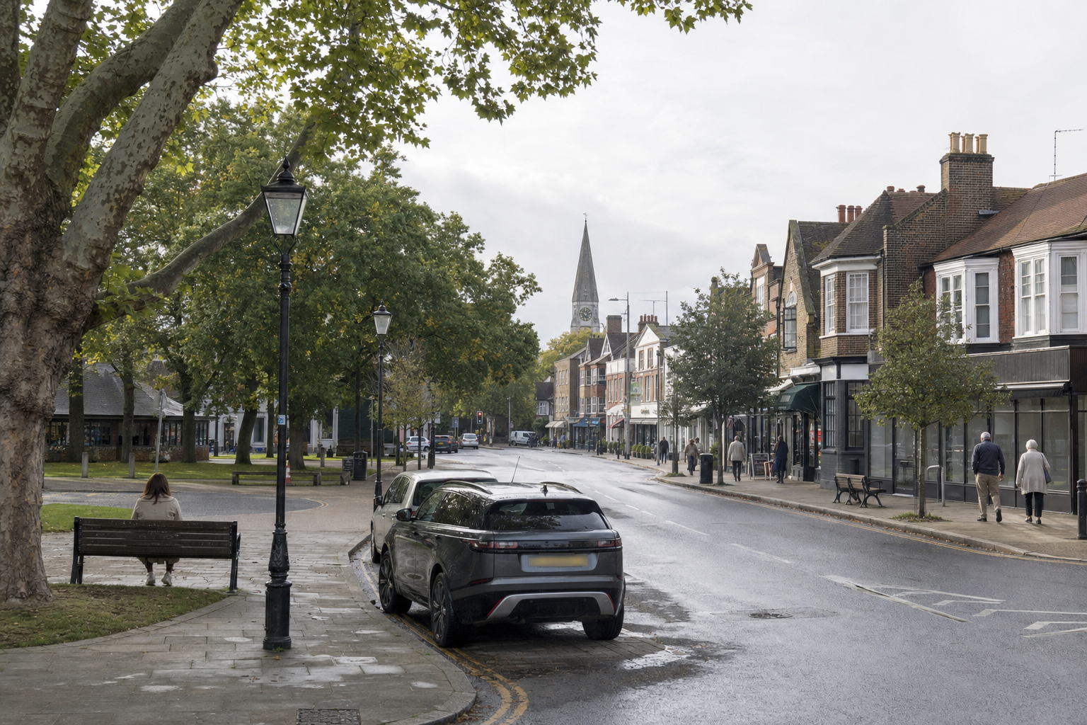 A quiet street scene with parked cars, shops, a person on a bench, and a distant church spire.