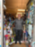 man standing outside his electrical goods shop