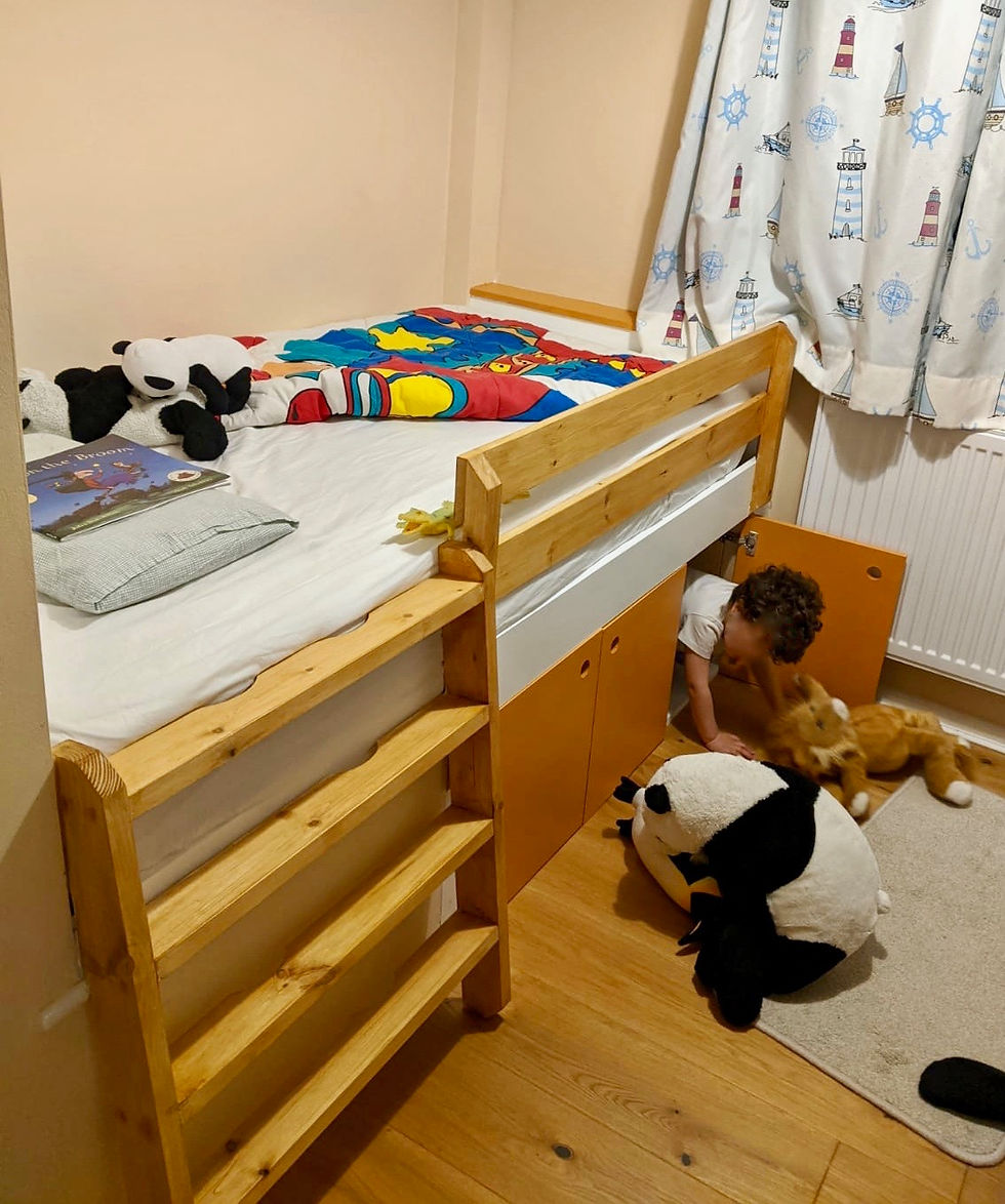 Child's cabin bed built over stair angle