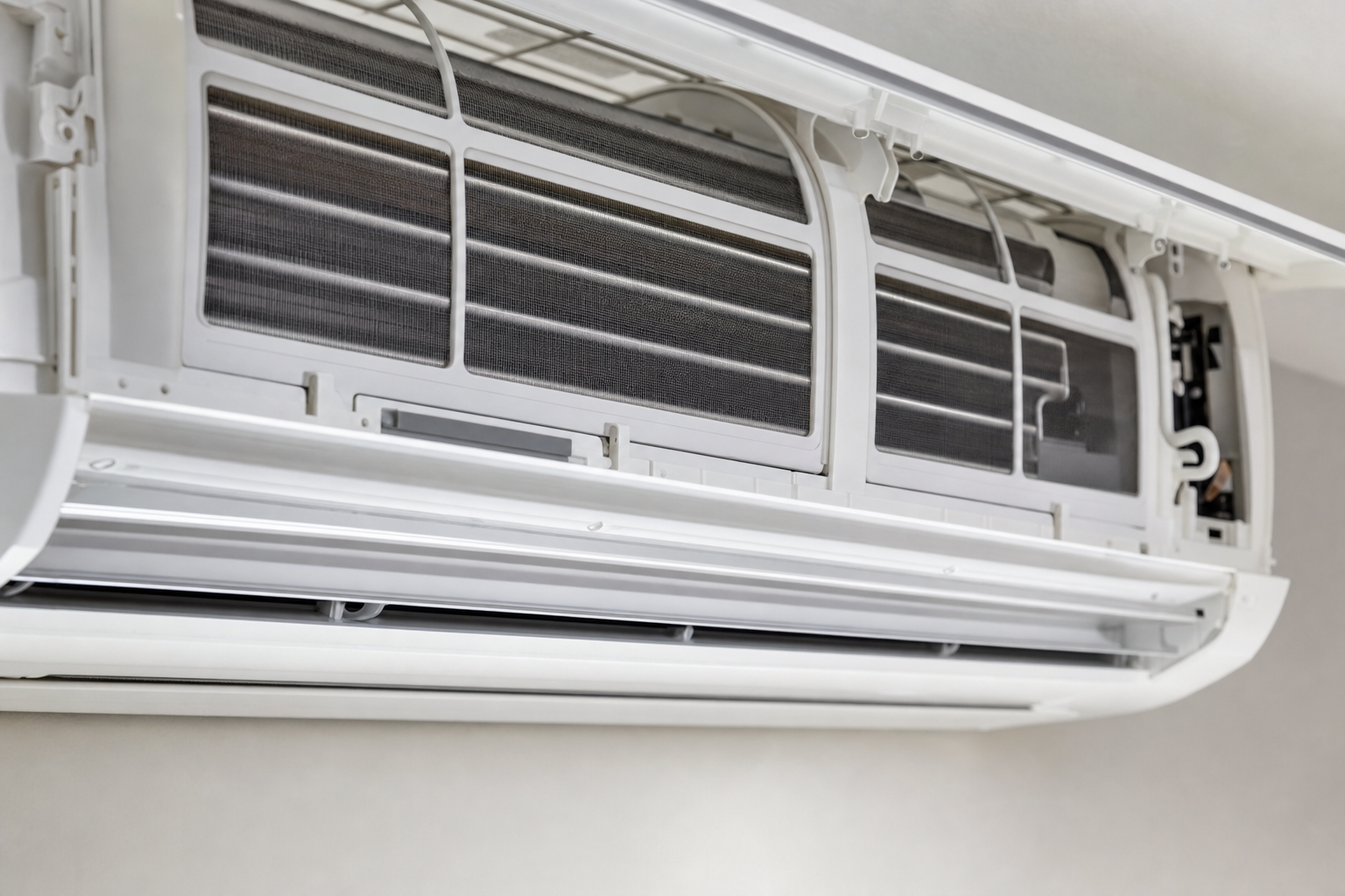 Open air conditioning unit with visible filters and internal components.