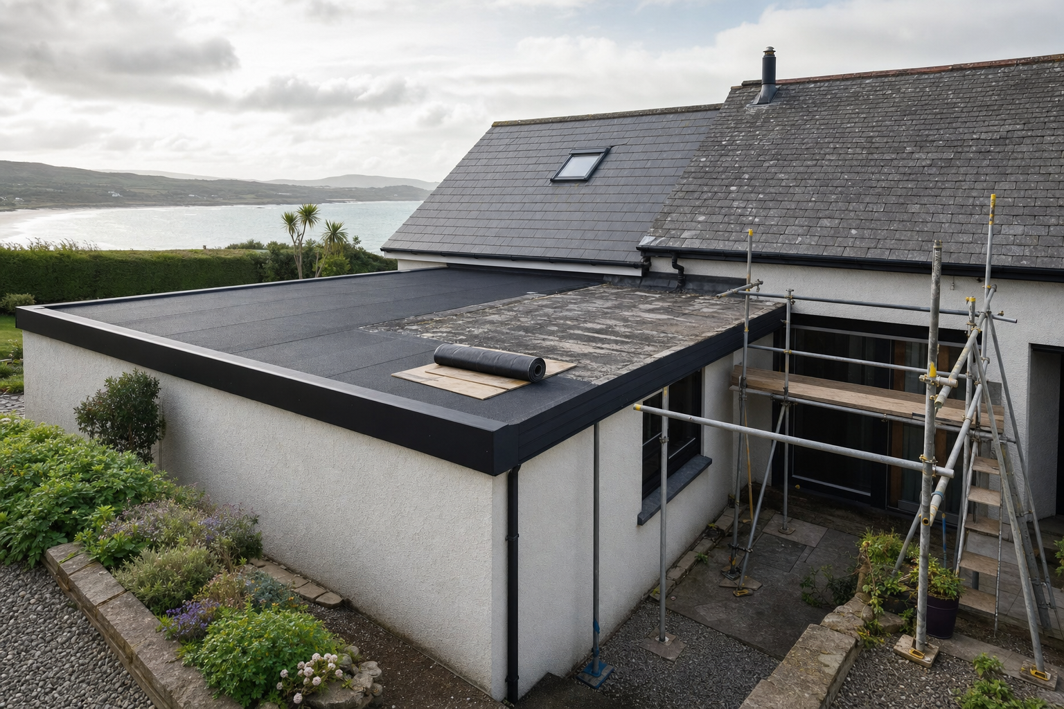 A house with scaffolding undergoing roof repair, overlooking a coastal landscape.